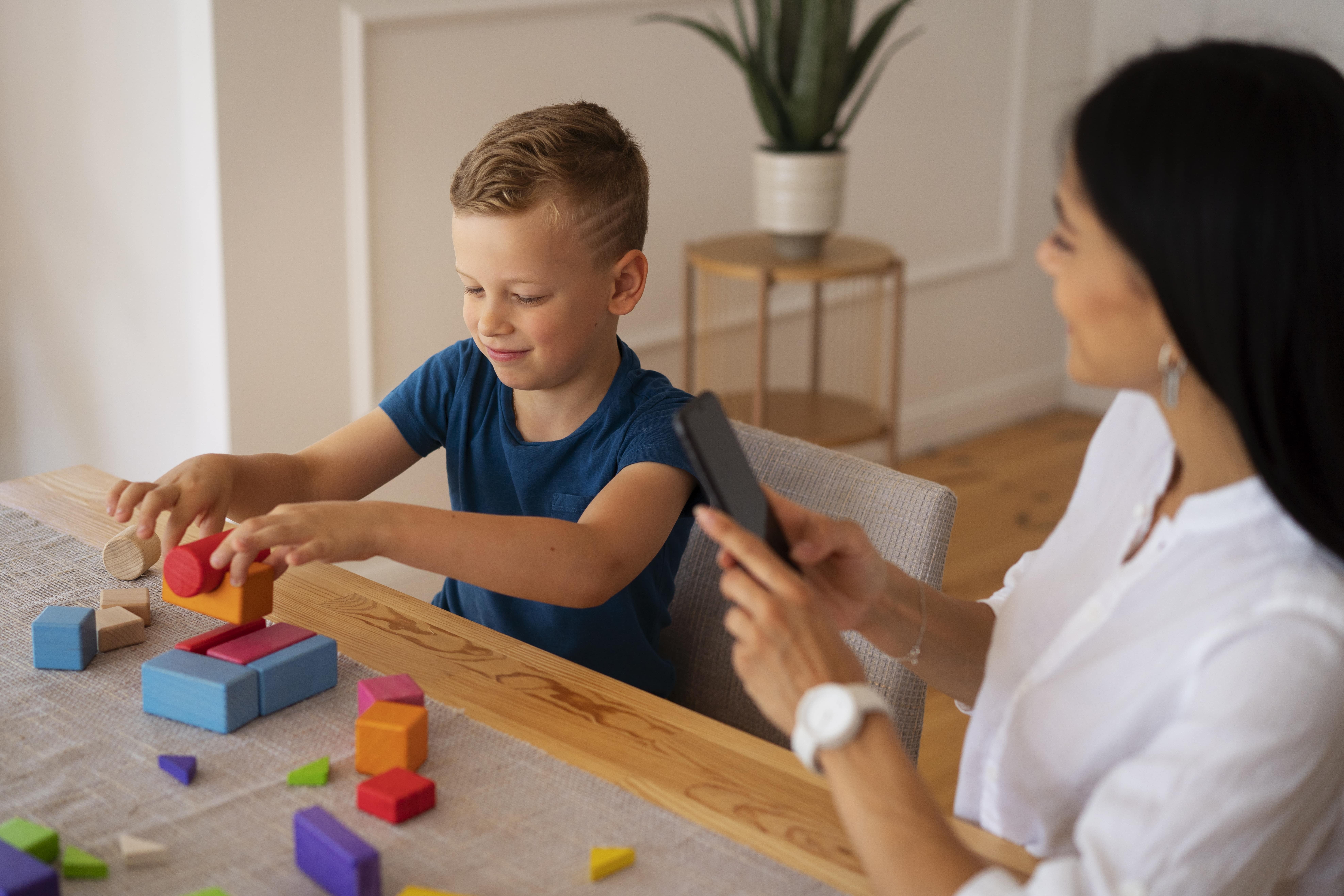 young boy with a woman doing brain exercises